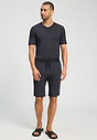 Full-body view of a men model wearing HA charcoal melange modal/viscose/tencel Short Pants