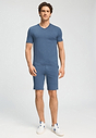 Full-body view of a men model wearing HA tanzanite melange modal/viscose/tencel Short Pants