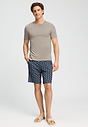 Full-body view of a men model wearing HA wooly beige cotton S/SLV Shirt