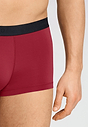 Close-up view of a men model wearing HA intense red microfibre Pants