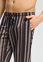 Close-up view of a men model wearing HA pinecone stripes cotton Long Pants