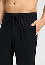 Close-up view of a men model wearing HA black cotton Long Pants