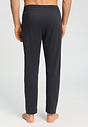 Back view of a men model wearing HA smokey charcoal cotton Long Pants