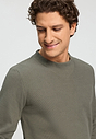 Close-up view of a men model wearing HA smokey olive cotton Pullover