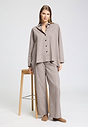 Full-body view of a women model wearing HA canyon brown wool Socks
