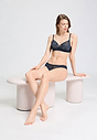 Full-body view of a women model wearing HA deep navy modal/viscose/tencel Mini Briefs