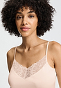 Close-up view of a women model wearing HA creamy glass modal/viscose/tencel Spaghetti Top