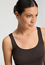 Close-up view of a women model wearing HA dark mocha cotton Tank Top