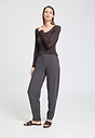 Full-body view of a women model wearing HA dark sesame cotton Long Pants
