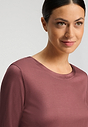 Close-up view of a women model wearing HA apple butter modal/viscose/tencel L/SLV Shirt