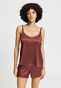 Front view of a women model wearing HA apple butter silk Spaghetti Top