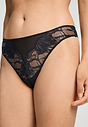 Close-up view of a women model wearing HA black microfibre Thong