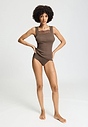 Full-body view of a women model wearing HA natural teak wool Tank Top