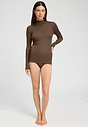 Full-body view of a women model wearing HA natural teak wool Turtle-Neck Shirt
