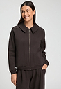 Front view of a women model wearing HA dark mocha cotton Cardigan