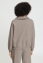 Back view of a women model wearing HA rose grey cotton Cardigan