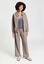 Full-body view of a women model wearing HA rose grey cotton Cardigan