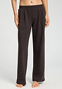 Front view of a women model wearing HA dark mocha cotton Long Pants