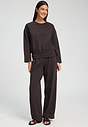 Full-body view of a women model wearing HA dark mocha cotton Long Pants