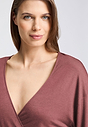 Close-up view of a women model wearing HA apple butter modal/viscose/tencel L/SLV Shirt