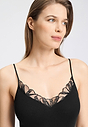 Close-up view of a women model wearing HA black cotton Spaghetti Top