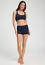 Full-body view of a women model wearing HA deep navy microfibre Crop Top