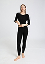 Full-body view of a women model wearing HA black wool 3/4 SLV Shirt