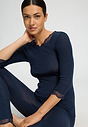 Close-up view of a women model wearing HA deep navy wool 3/4 SLV Shirt