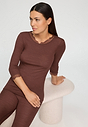 Close-up view of a women model wearing HA cinnamon wool 3/4 SLV Shirt