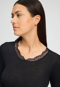 Close-up view of a women model wearing HA black wool L/SLV Shirt