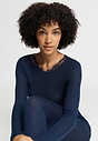 Close-up view of a women model wearing HA deep navy wool L/SLV Shirt
