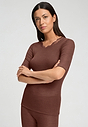 Front view of a women model wearing HA cinnamon wool S/SLV Shirt