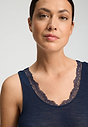 Close-up view of a women model wearing HA deep navy wool Tank Top