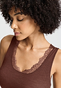 Close-up view of a women model wearing HA cinnamon wool Tank Top