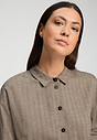 Close-up view of a women model wearing HA earthy woven cotton Blouse