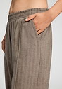 Close-up view of a women model wearing HA earthy woven cotton Long Pants