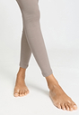 Close-up view of a women model wearing HA rose grey wool Leggings