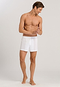 Full-body view of a men model wearing Hanro white cotton Boxers