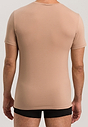 Back view of a men model wearing Hanro neutral cotton S/SLV Shirt V-Neck