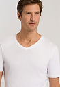 Close-up view of a men model wearing Hanro white cotton S/SLV Shirt V-Neck