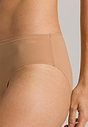 Close-up view of a women model wearing Hanro nude microfibre Midi Briefs