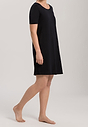 Full-body view of a women model wearing Hanro black cotton S/SLV Nightdress 90cm