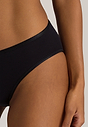 Close-up view of a women model wearing Hanro black cotton Midi Briefs