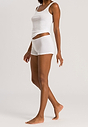 Full-body view of a women model wearing Hanro white cotton Shortleg Pants