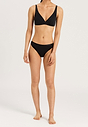 Full-body view of a women model wearing Hanro black cotton Soft Cup Bra