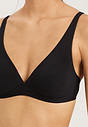 Close-up view of a women model wearing Hanro black cotton Soft Cup Bra