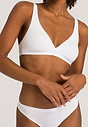 Front view of a women model wearing Hanro white cotton Soft Cup Bra
