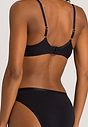 Back view of a women model wearing Hanro black cotton U/wire Bra