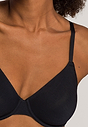 Close-up view of a women model wearing Hanro black cotton U/wire Bra