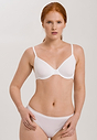 Front view of a women model wearing Hanro white cotton U/wire Bra